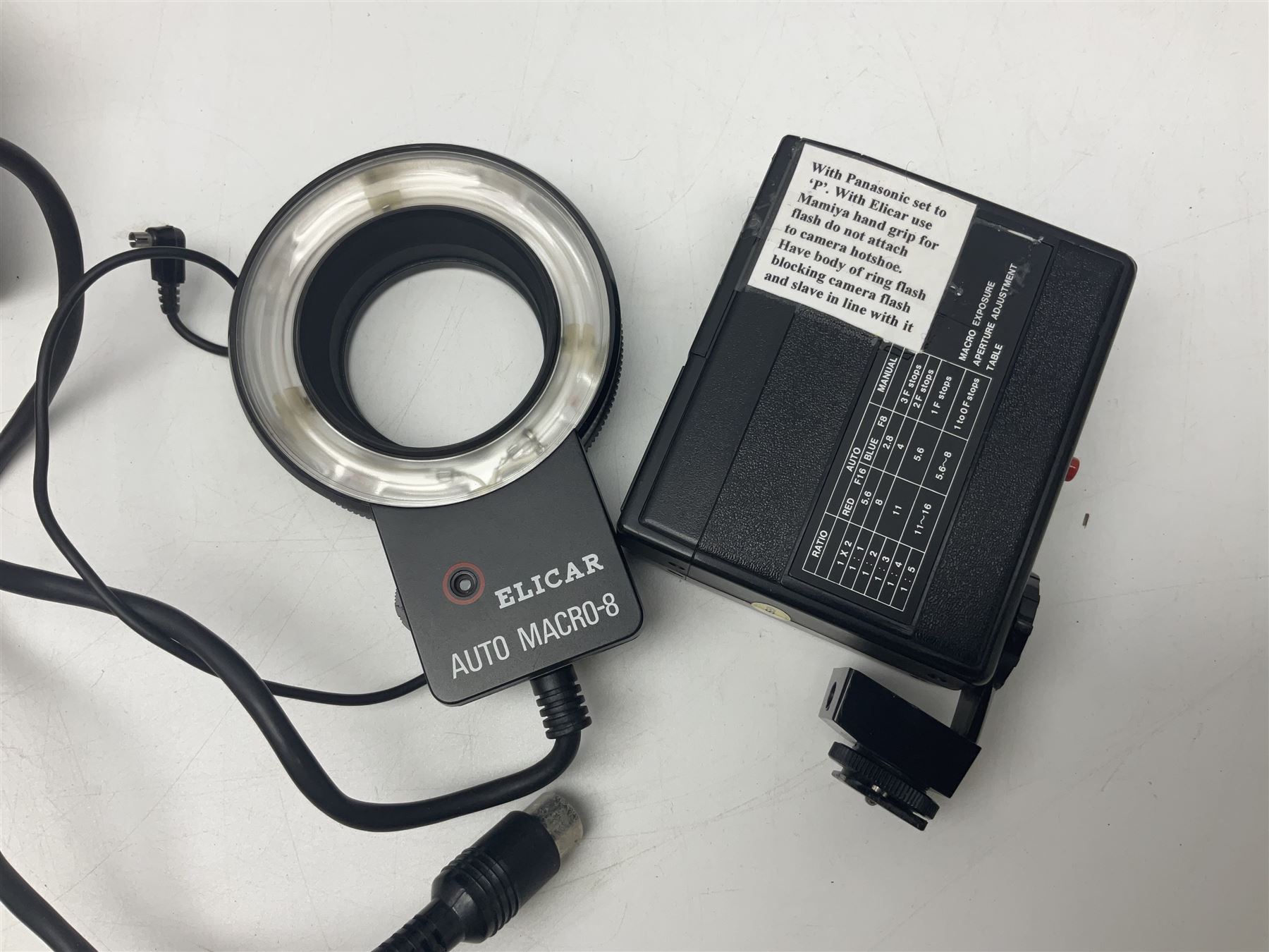 Yukon rubber armoured compact variable power spotting scope (boxed), together with Bresser 10x50 binoculars, Bushnell Excursion 10x42 binoculars, camera equipment etc  