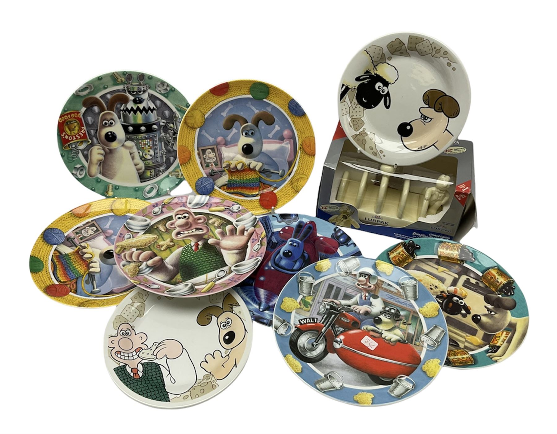 Eight Wallace and Gromit collectors plates, including ‘The Window Cleaners’ and ‘Morning Mayhem’ by Churchill Compton & Woodhouse, with boxes and certificates and two examples by Jacobs and limited edition Lurpak toast rack in box