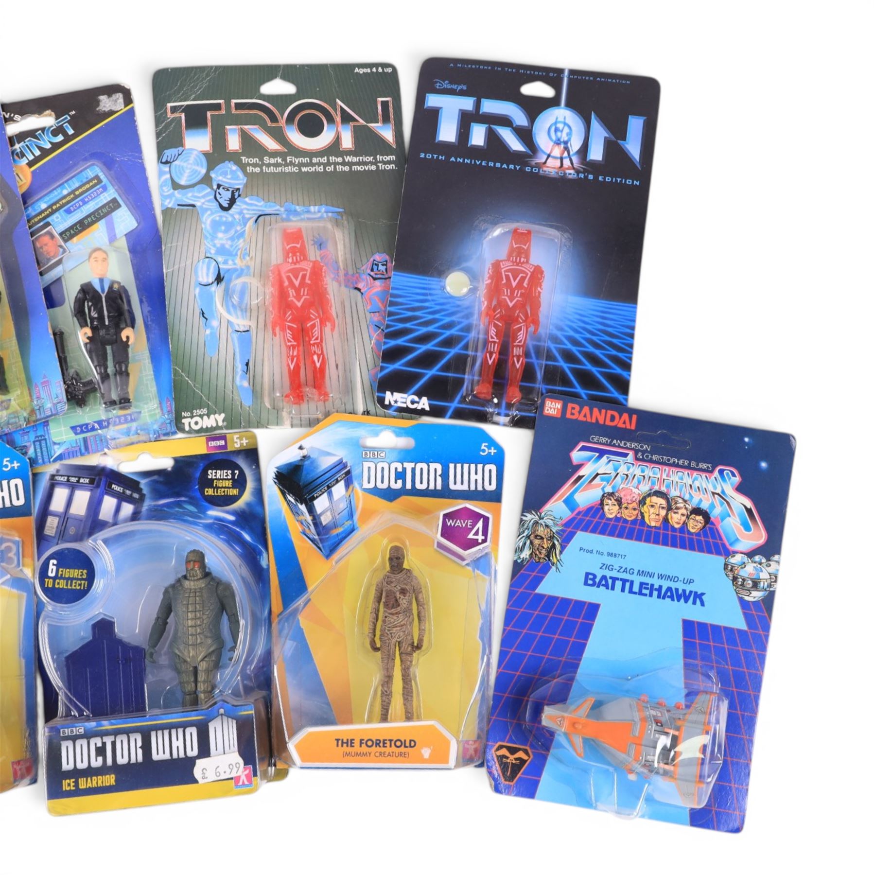 Nine TV & Film figures, comprising Neca 20th Anniversary Disney's Tron Sark, Tomy Disney's Tron Sark, four Gerry Anderson's Space Precinct Lieutenant Brogan and Captain Podly figures and Character Doctor Who Skovox Blitzer, Ice Warrior and The Foretold figures, together with a Bandai Terrahawks Zig-Zag Mini Wind Up Battlehawk, all carded