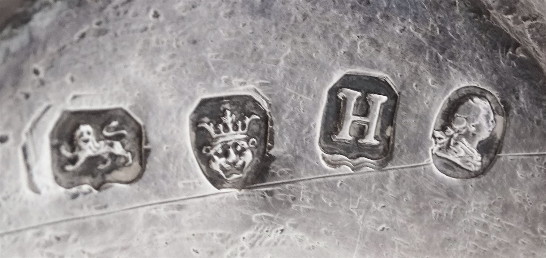 Set of four George III silver pedestal table salts, of navette form with gilt interiors and blue glass liners, hallmarked Solomon Hougham, London 1802 and 1803, together with a set of four George III Old English pattern salt spoons with gilt bowls, hallmarked London 1797, maker's mark WS, salts H6.5cm L10cm, gross weight exclusive of liners 11.51 ozt (358 grams)