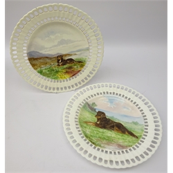  Pair late Victorian reticulated cabinet plates hand painted with dogs in a moorland landscape, by Eva Langham, 1876, D24cm   