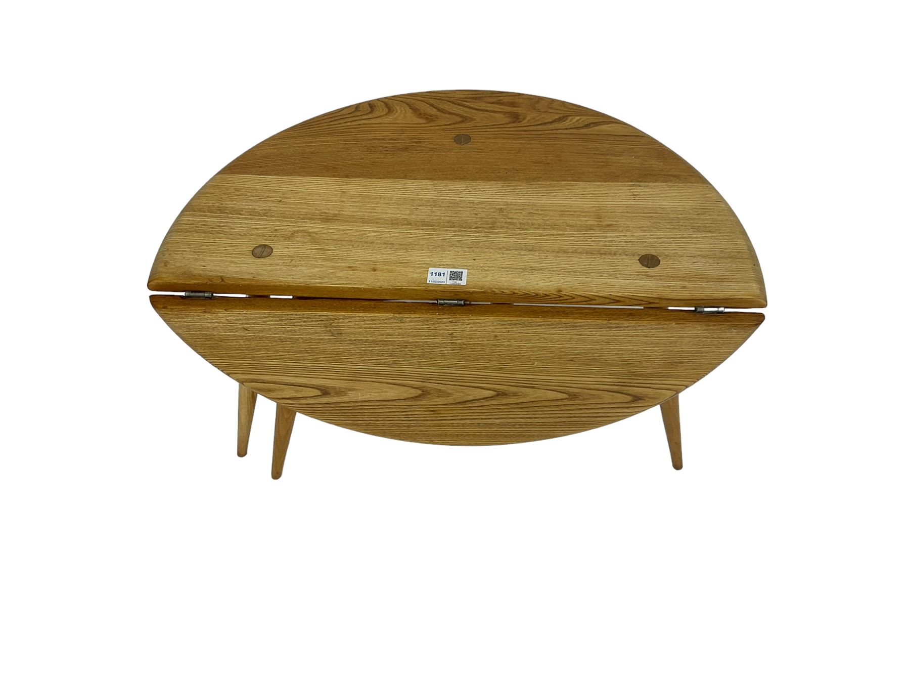 Ercol - elm and beech '308 Folding Occasional Table', circular top with gate-leg and splayed tapering supports