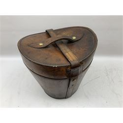 Early 20th century black silk top hat by Woodrow of Manchester and London, with manufacturer's stamp to the silk lined interior, housed in fitted tan leather hat box with removable internal compartments with straps, brass escutcheon and engraved plaque, hat internal measurements approx 20cm x 15cm