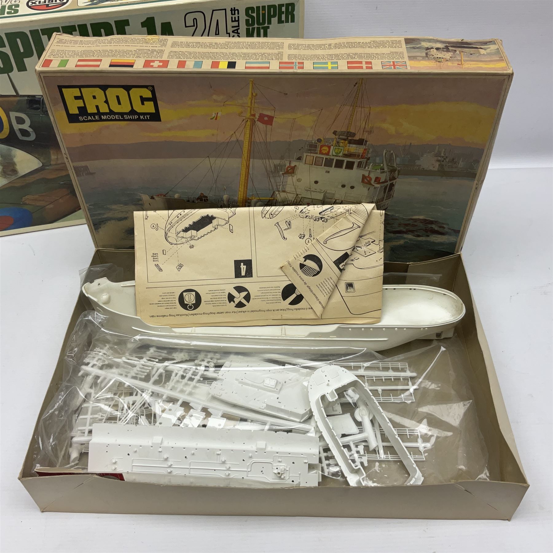 Three unmade construction kits - Airfix 1:24 scale Supermarine Spitfire Mk.1A; predominantly in unopened factory packaging with instructions and decal sheet; Frog Shell Welder with instructions; and Airfix Battle of Waterloo Farmhouse (instructions on box base); all boxed (3)