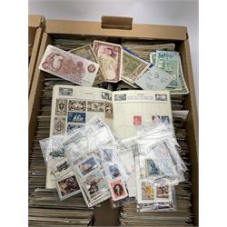 Edwardian and later postcards, many topographical, stamps in 'The Wirlwind' album and loose, small number of Great British and World banknotes including The States of Guernsey one pound, Bank of England ten shillings '94X', Ireland one pound etc and other items of ephemera 