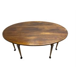 Large oak dining table, oval drop leaf top, double gate-leg action base, cabriole supports