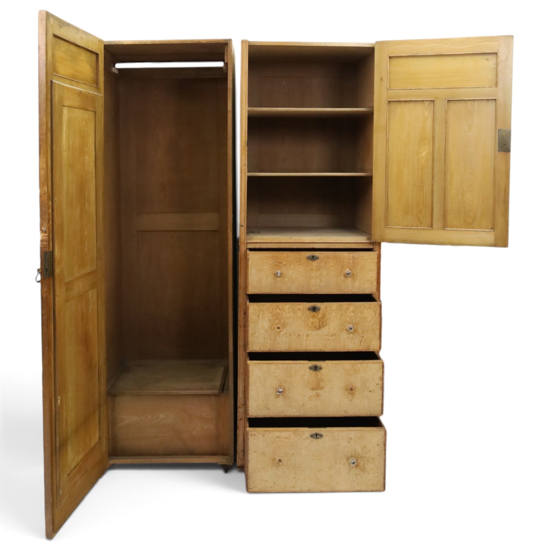 Edwardian Neoclassical figured ash and inlaid double combination wardrobe, the left section with mirrored door enclosing a hanging rail, the right section with cupboard door above four graduated drawers with glass knobs, raised on castors