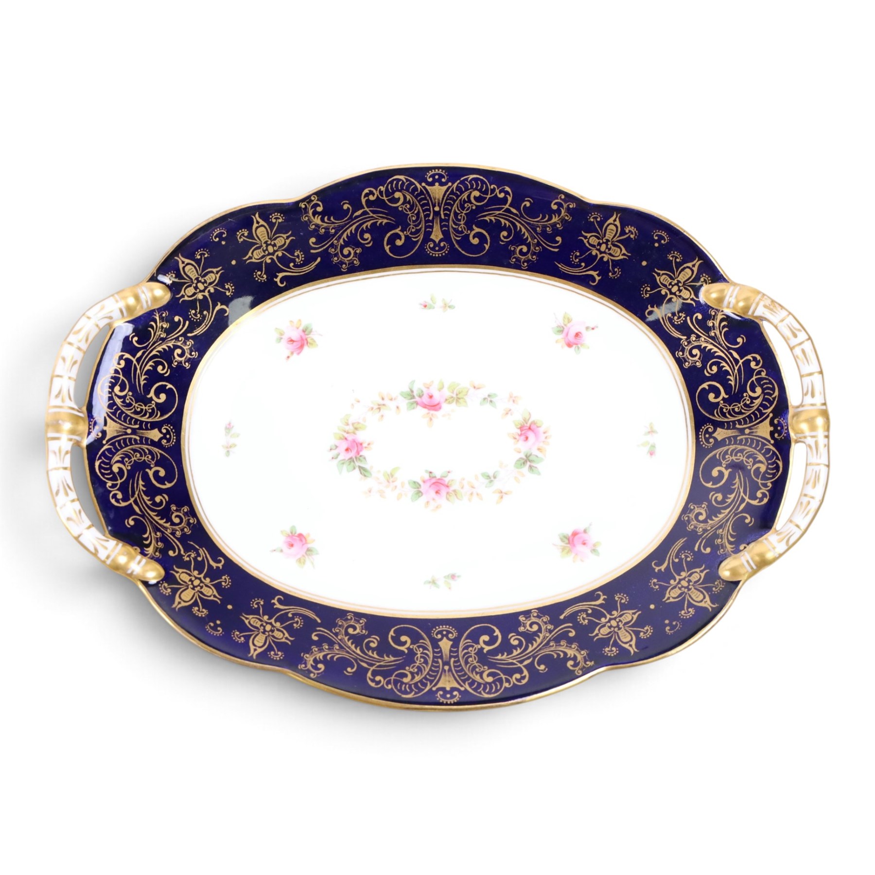 Coalport set of ten plates and four serving plates, each decorated with floral sprigs within a cobalt blue boarder with gilt detail, plates D22cm