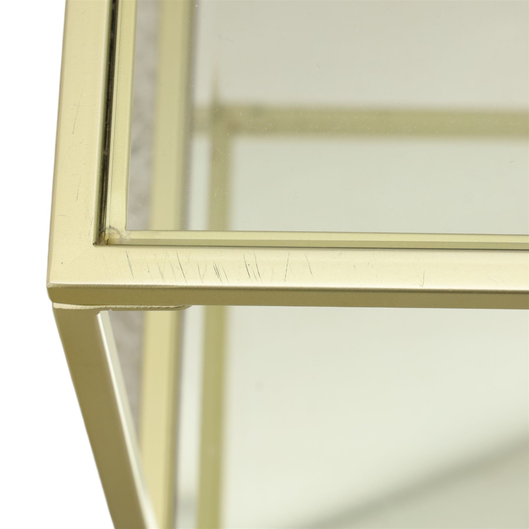 Modern pair of brass finish and glass bedside stands, each of square form with clear glass top, glazed sides and mirrored under tier, enclosed by a square section brass finish metal frame, raised on short square supports