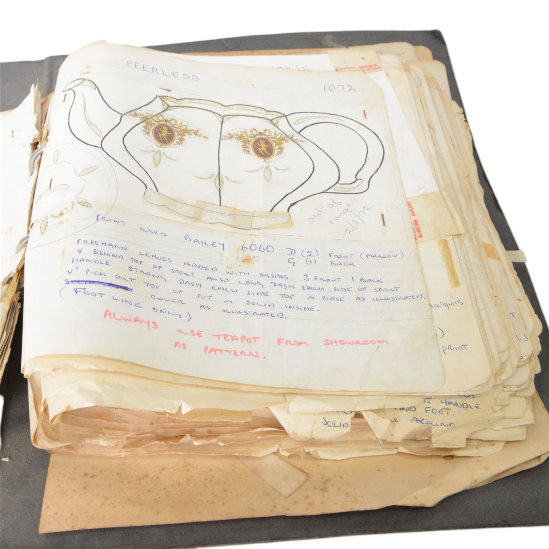 Wood & Sons Ltd Burslem pattern book, late 20th century, designs in colour and black and white, all mounted onto square leaves, leaves annotated with decorating notes, some cancellations noted boldly over the design, collected as one in a ring binder, factory labels to upper-cover, folio 44.5 x 36cm