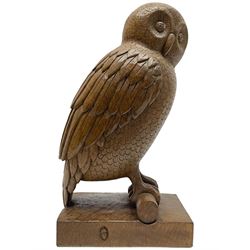 Acornman - carved oak owl perched on branch, on tooled block plinth carved with acorn signature, by the workshop of Alan Grainger, Brandsby (carved by Norman Darnley)