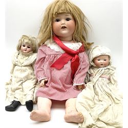 Armand Marseille Koppelsdorf bisque head doll with applied hair, sleeping eyes, open mouth with teeth and composition body with jointed limbs, marked 'AM Koppelsdorf Germany 1330 A12M' H62cm; and two similar smaller AM dolls marked '390 A3/0 XM' and 'AM Germany 351./3.K.' (3)