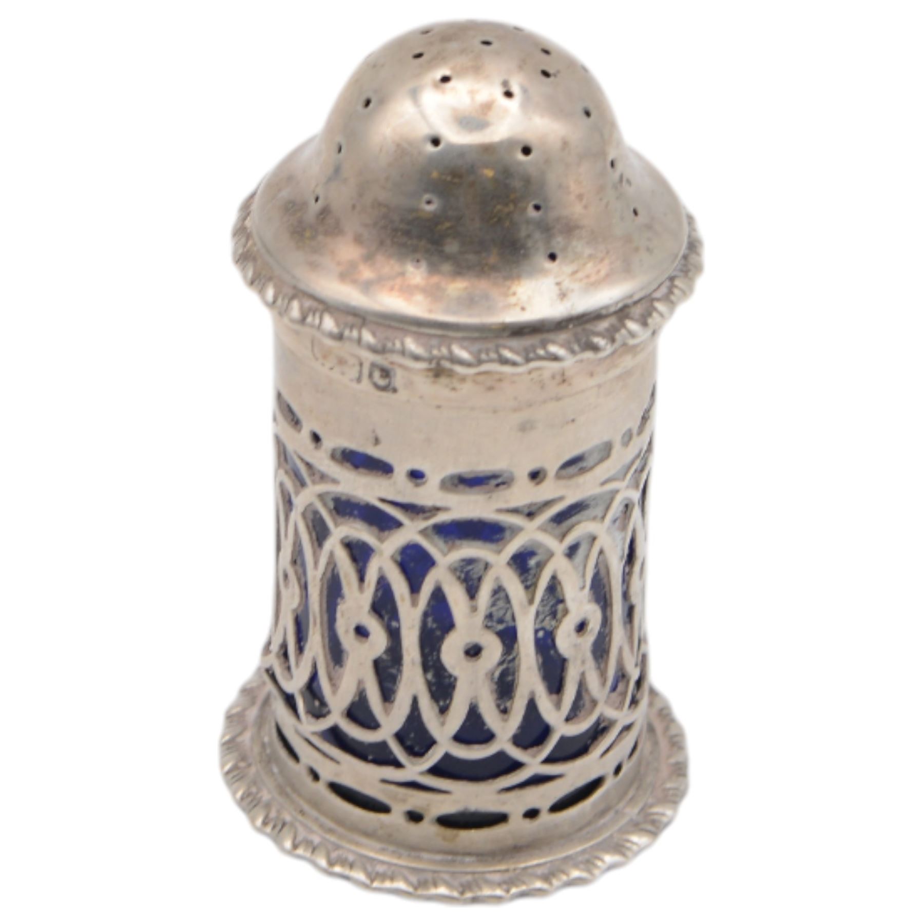 Late Victorian silver three piece cruet set, comprising open salt, pepper pot and mustard pot with cover, all with pierced decoration and upon four bun feet, hallmarked John Charles Lowe, London 1899 and 1900, salt with different maker's mark worn and indistinct, all with blue glass liners