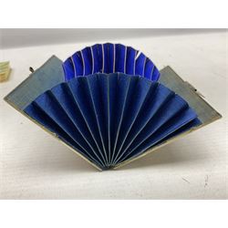 Mother of pearl and abalone inlaid card case, with central diamond shaped panel engraved with foliate decoration, together with a simulated mother of pearl card case of book form with green sun rays to cover, and simulated wood effect cigarette case with hinged lid with diamante style banding, largest L10cm