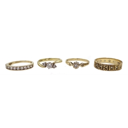 Gold single stone diamond ring with diamond set shoulders and three gold cubic zirconia set rings, all 9ct hallmarked or stamped (4)
