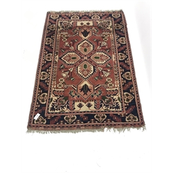 Turkish red ground rug , central medallion, repeating border, 178cm x 121cm