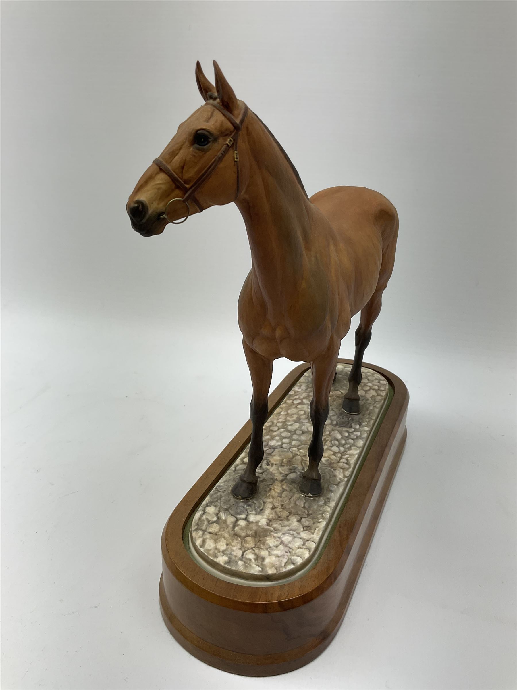 A Royal Worcester limited edition figure, Arkle, owned by the Duchess of Westminster, modelled by Doris Lindner, on wooden base, H27cm. 