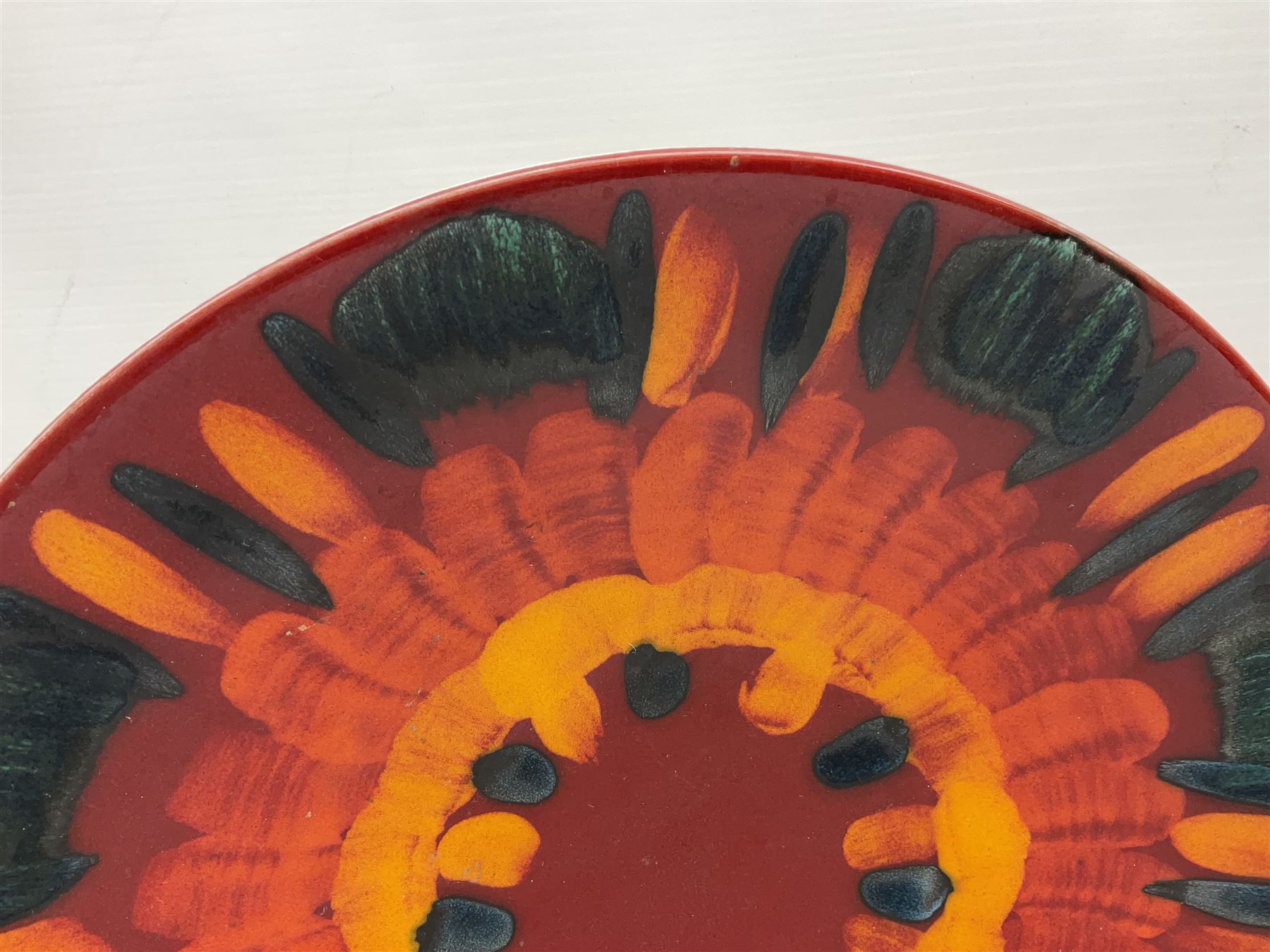 Collection of Poole Pottery, comprising charger and vase in Volcano pattern and a duck figure in a similar pattern 