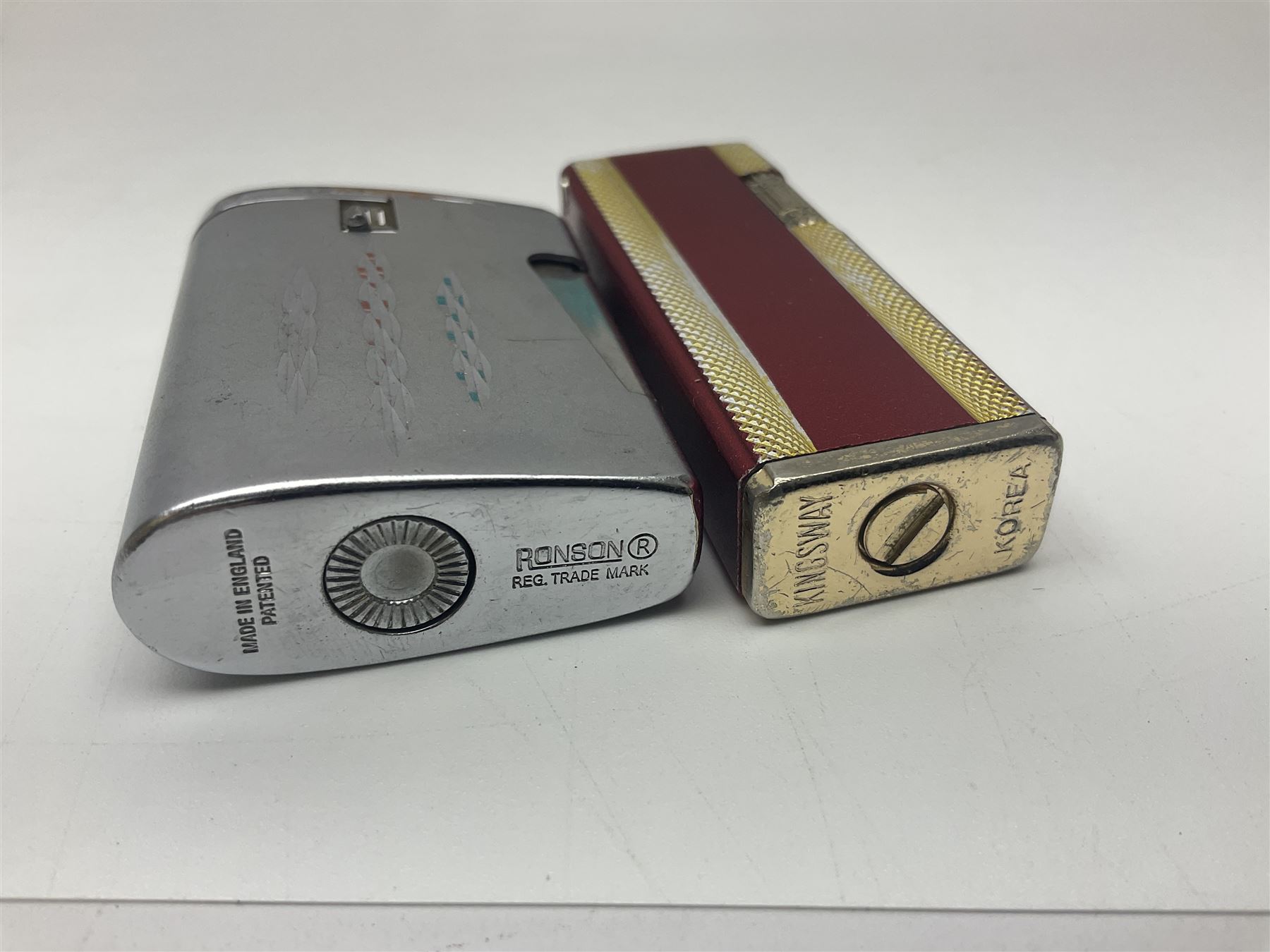 Seven pen knives, two lighters, including one Ronson example and a collection of postcards