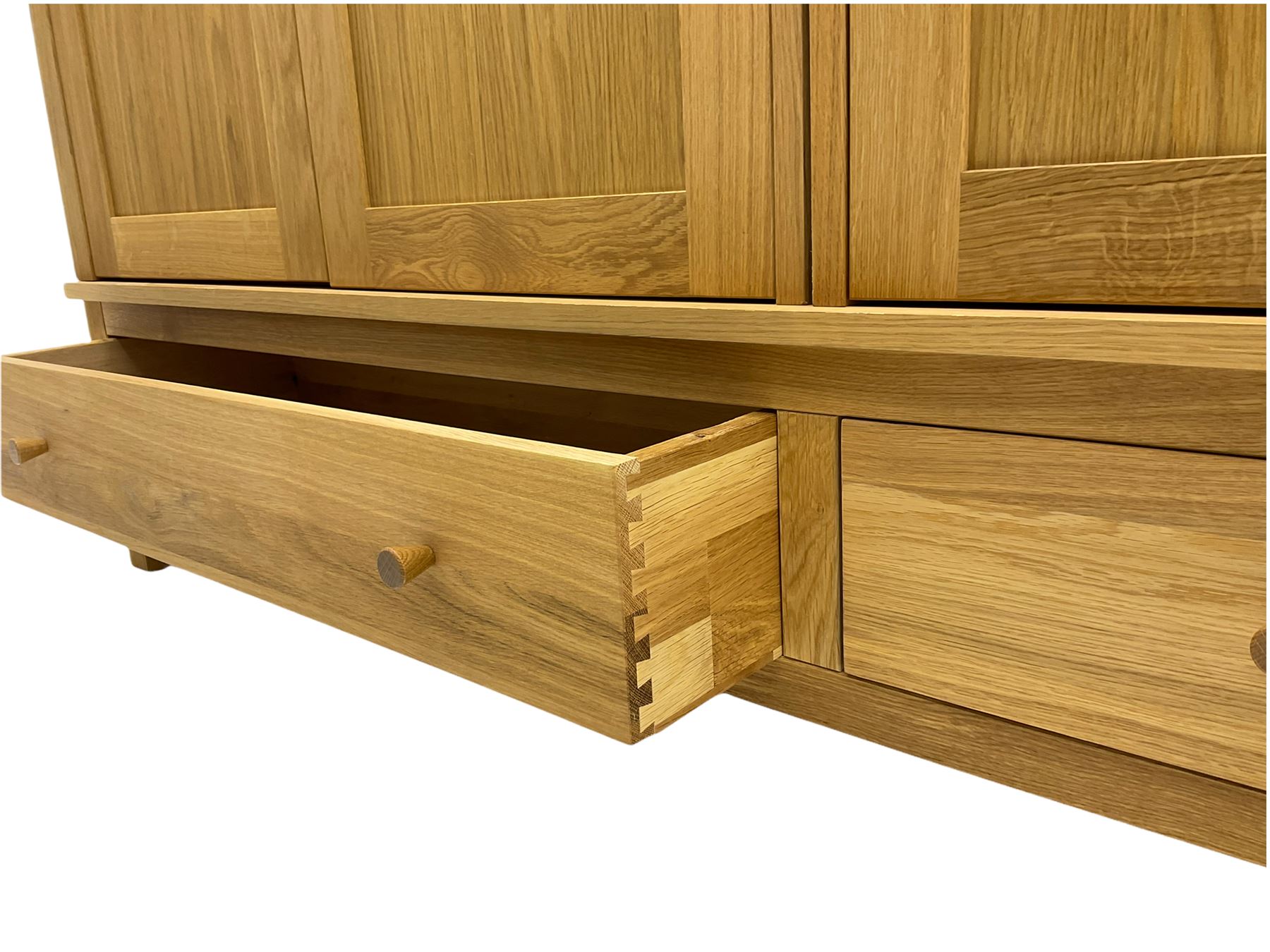 Corndell Furniture - light oak triple wardrobe, enclosed by three panelled doors, one long and one short drawer