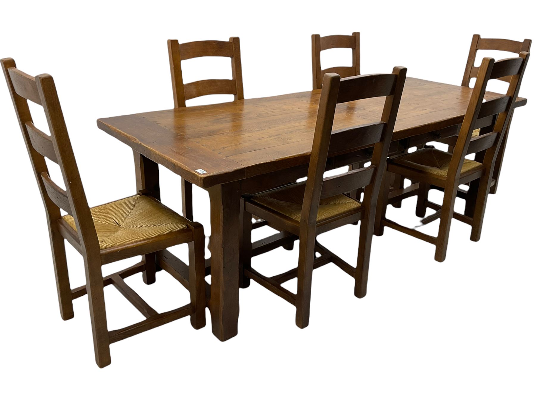 Antix French oak dining table with two leaves, two frieze drawers;, and six ladder back chairs with rush seats