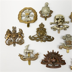 Twelve metal cap badges including South Lancashire Prince of Wales Volunteers, Australian Commonwealth Military Forces, 10th Royal Hussars, Royal Warwickshire, The Royal Sussex Regt., RASC, REME etc