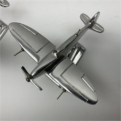 Set of three aluminium planes with rotating propellers, tallest H18cm