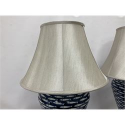 Pair of large lamps of tapering form, decorated in blue myriad fish pattern, on brushed chrome pedestals, including shade H75cm