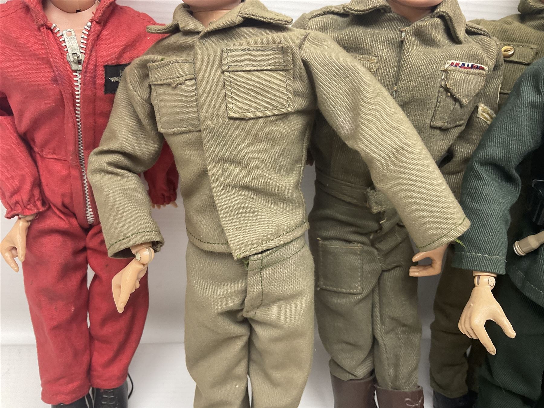 Action Man - five figures marked on the back 'Made in England by Palitoy under licence from Hasbro 1964', one dressed as a German Stormtrooper, one as a Red Devil Pilot and three in army uniform; another similar action figure marked to the right buttock ' G.I. Joe Copyright 1964 by Hasbro Patent Pending Made in Canada' dressed in army uniform; together with an Action Man jeep, field gun, mortar and machine guns and other accessories including helmets and weapons, parachute, diving equipment, skis and snow shoes, boots, uniforms etc; all unboxed