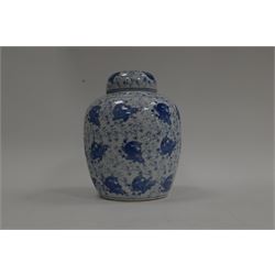 Blue and white ginger jar, decorated in a repetitive pattern of fish swimming amongst dense clusters of aquatic foliage, H40cm