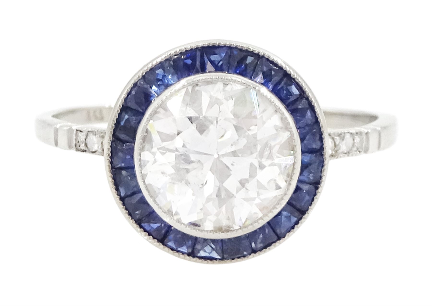 Platinum diamond and sapphire target ring, milgrain set single old cut diamond of 1.53 carat, with calibre cut sapphire surround and rose cut diamond set shoulders, stamped 950