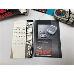 Two Super Nintendo Entertainment System (PAL) controllers, accessories and games. Super NES Game Commander with original box and instruction booklet, Super NES Nintendo Scope (1992) transmitter gun, receiver, Super NES Nintendo Scope 6 game with original instruction booklets. Further games to include ‘The Legend of Zelda a Link to the Past’, ‘Super Mario World’, ‘Super Mario Kart’, ‘The Lawnmower Man’, and ‘Exhaust Heat’, all with original instruction booklets. ‘PowerMonger’ and Disney’s ‘Aladdin’ game cartridges only 