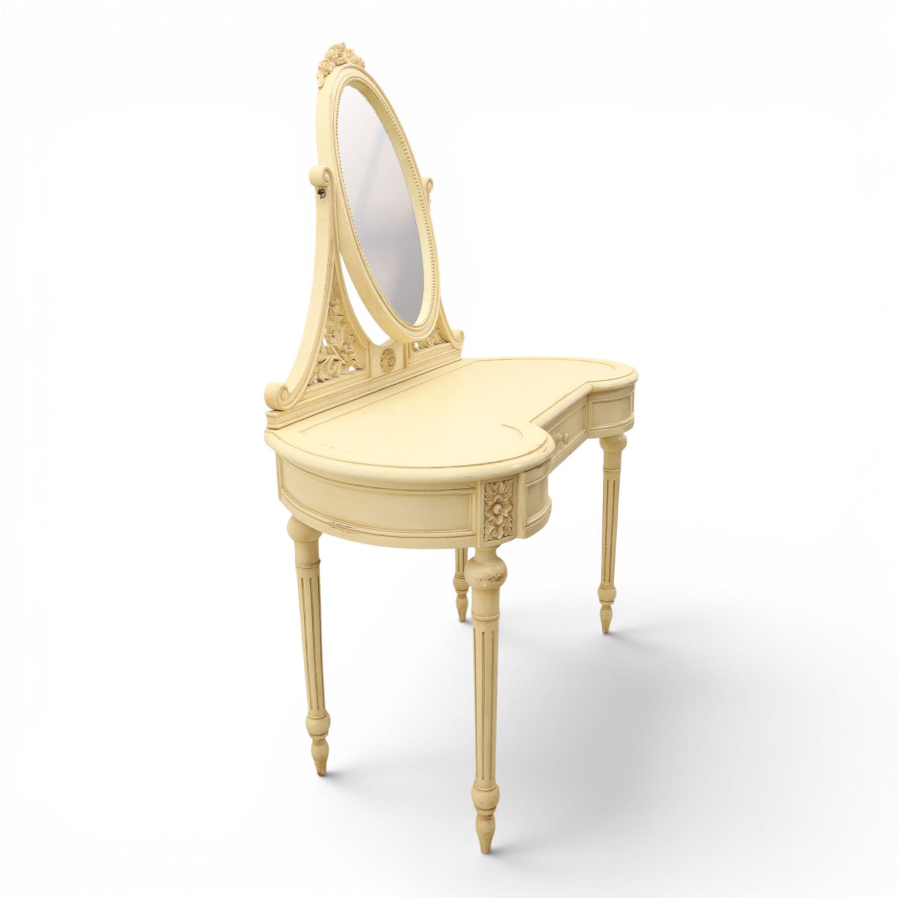 French Louis XV design cream painted dressing table and matching stool, kidney shaped top, with tilting oval mirror, carved uprights raised on fluted and turned supports 
