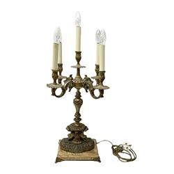 French style gilt metal four branched candelabra supported by fawns and upon a rectangular lion claw base, H77cm 