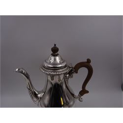 Mid 20th century three piece silver coffee service, comprising coffee pot, milk jug and twin handled open sucrier, of waisted form upon circular domed foot,  with oblique gadrooned rim, the milk jug and sucrier with acanthus capped handles, the coffee pot with wooden handle and finial, hallmarked William Comyns & Sons Ltd , London 1961, coffee pot H27.5cm