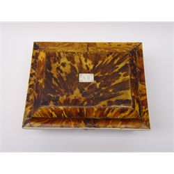 19th century tortoiseshell sewing box, of sarcophagal form upon four foliate detailed brass ball feet, the hinged cover edged in ivory with initialled silver plaque to centre, opening to reveal a silk lined interior, H9.5cm W22.5cm D18cm
