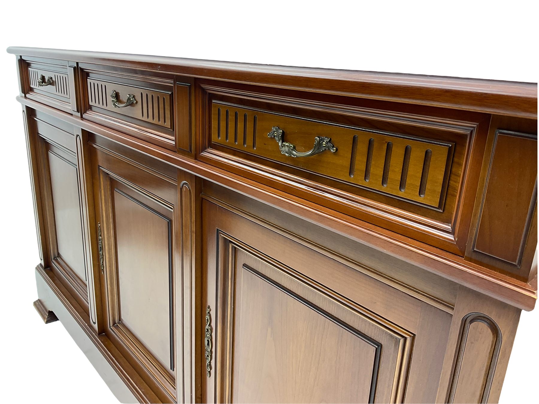 Contemporary cherry wood sideboard, rectangular moulded top over three drawers and three cupboards