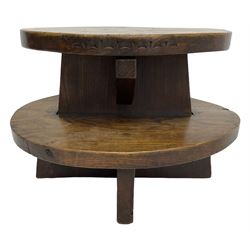 20th century figured elm occasional table, two oval tiers raised on cruciform base, the top tier carved with incised decoration 