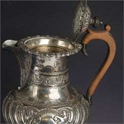 Victorian silver four piece tea service, comprising hot water pot, teapot, milk jug and sugar bowl, of circular part fluted bellied form, with embossed and engraved floral decoration, engraved with initials to body, the teapot and hot water pot with wooden handles and finials, hallmarked Z Barraclough & Sons, Sheffield 1898