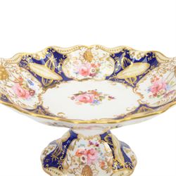 Collection of 19th century porcelain dessert wares, comprising Bloor Derby dish, circa 1825, Spode Felspar shaped oval dish, circa 1820, Ridgeway shaped oval footed dish with twin handles, circa 1840, Ridgeway dish, circa 1820, and tazza and dish, probably Minton, pattern 4810, each decorated in various patterns with floral sprays against dark blue grounds and heightened with gilt