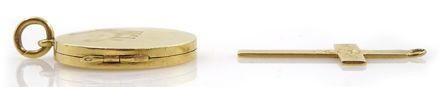 Gold circular locket and a gold cross, both hallmarked 18ct, approx 7.8gm
