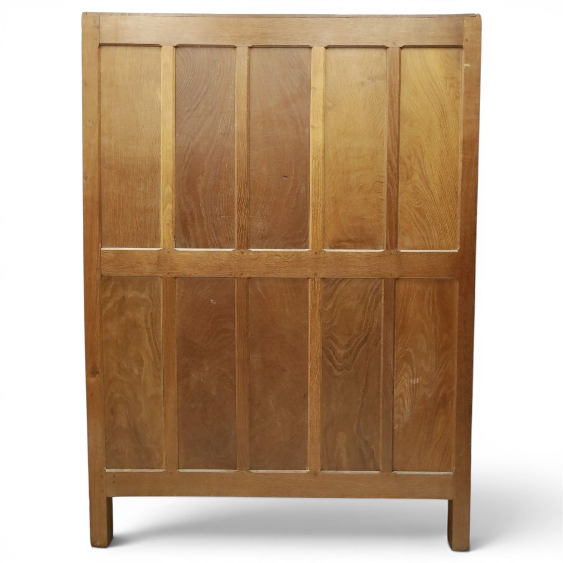 Mouseman - early-to-mid-20th century panelled and adzed double wardrobe, the arcade carved cresting rail over two panelled doors, with wrought metal hinges and latch, deep relief carved mouse signature, the interior fitted with hanging rail, by the workshop of Robert Thompson of Kilburn