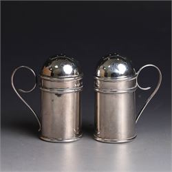 Pair of Edwardian silver muffineers, of cylindrical form with C scroll handles and removable pierced covers, hallmarked G E Walton & Co Ltd, Birmingham 1906, H6cm