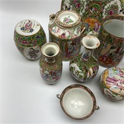 A 19th century Chinese famille rose cider mug, decorated with panels of figures, and birds, butterfly and flowers, H14.5cm, together with a selection of later famille rose, to include a pair of vases with waisted necks, H14.5cm, a further vase, H16cm, circular body and cover, etc. 