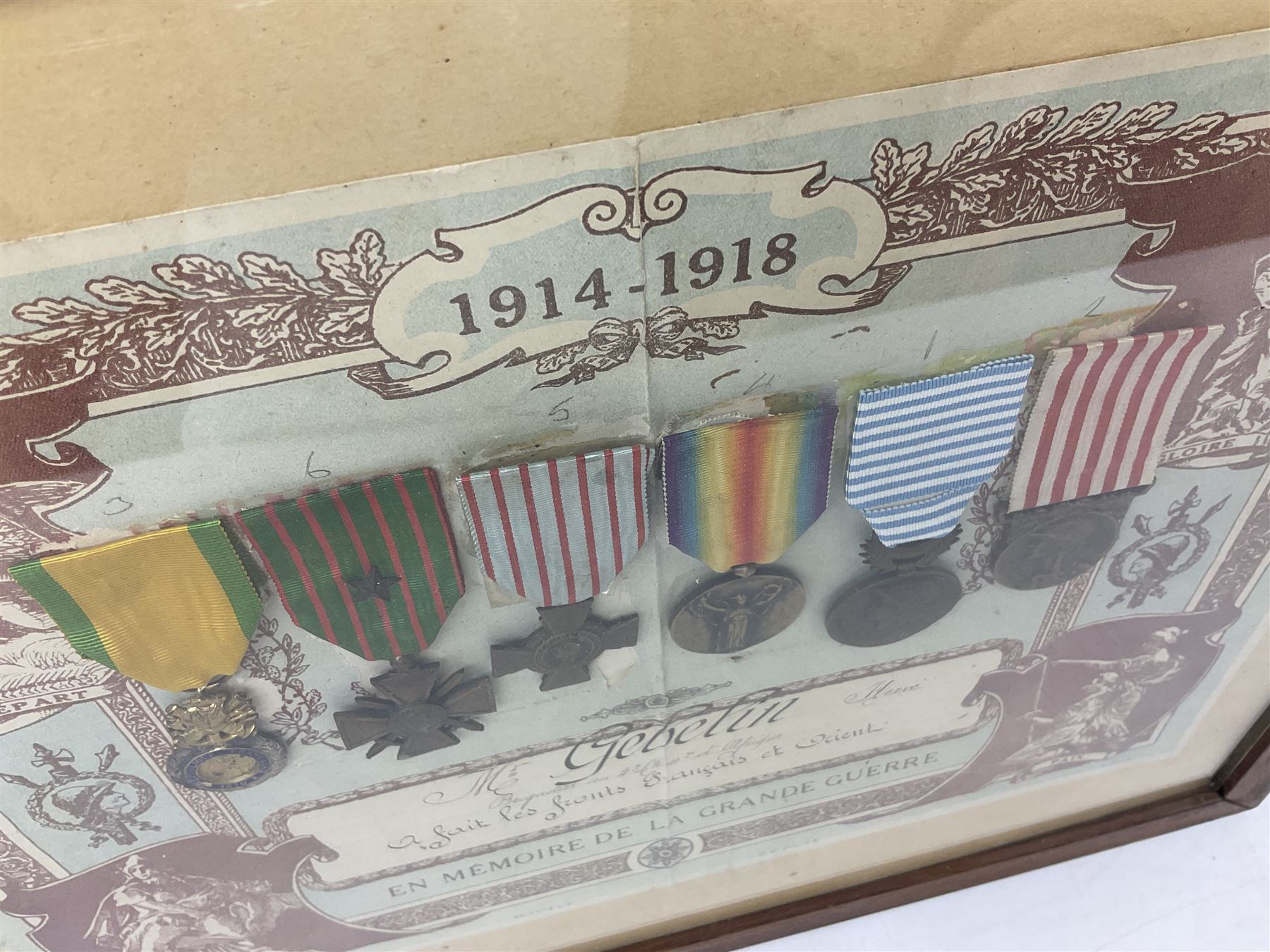 Six WW1 French medals comprising Valor Discipline 1870 3rd Republic Military Medal, Croix De Guerre with star, Croix Du Combattant, Medaille Inter-Alliee De La Victorie, Orient Medal and Medaille Commemorative De La Grande Guerre 1914-18; all with ribbons; mounted, framed and glazed with certificate named to Mr. Gebelin Herve Brigadier au 4th Chassrs. D'Afrique