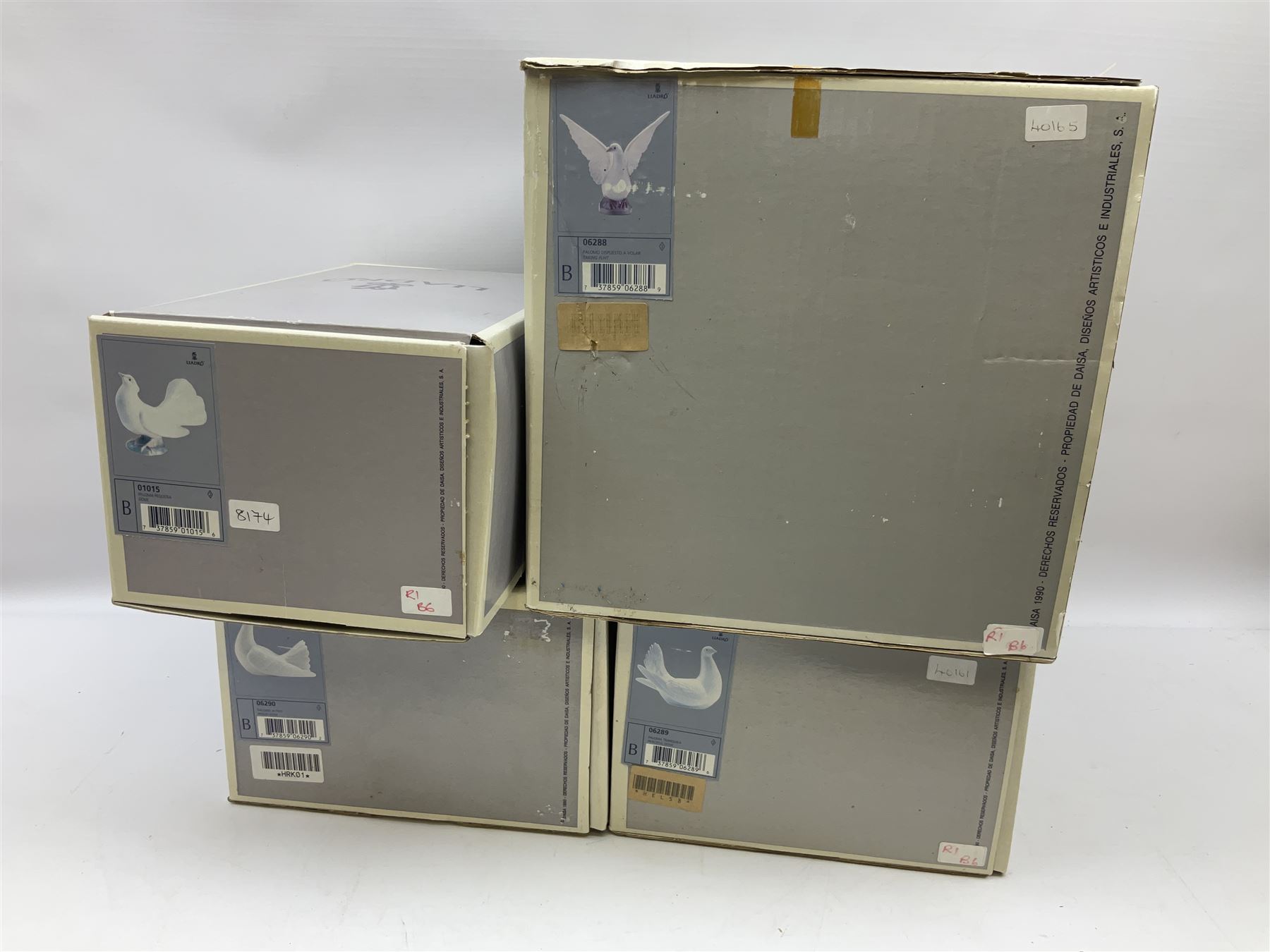 Four Lladro dove figures, comprising Taking Flight no 6288, Dove no 1015, Proud Dove no 6290 and Peaceful Dove no 6289, all with original boxes, largest example H20.5cm 