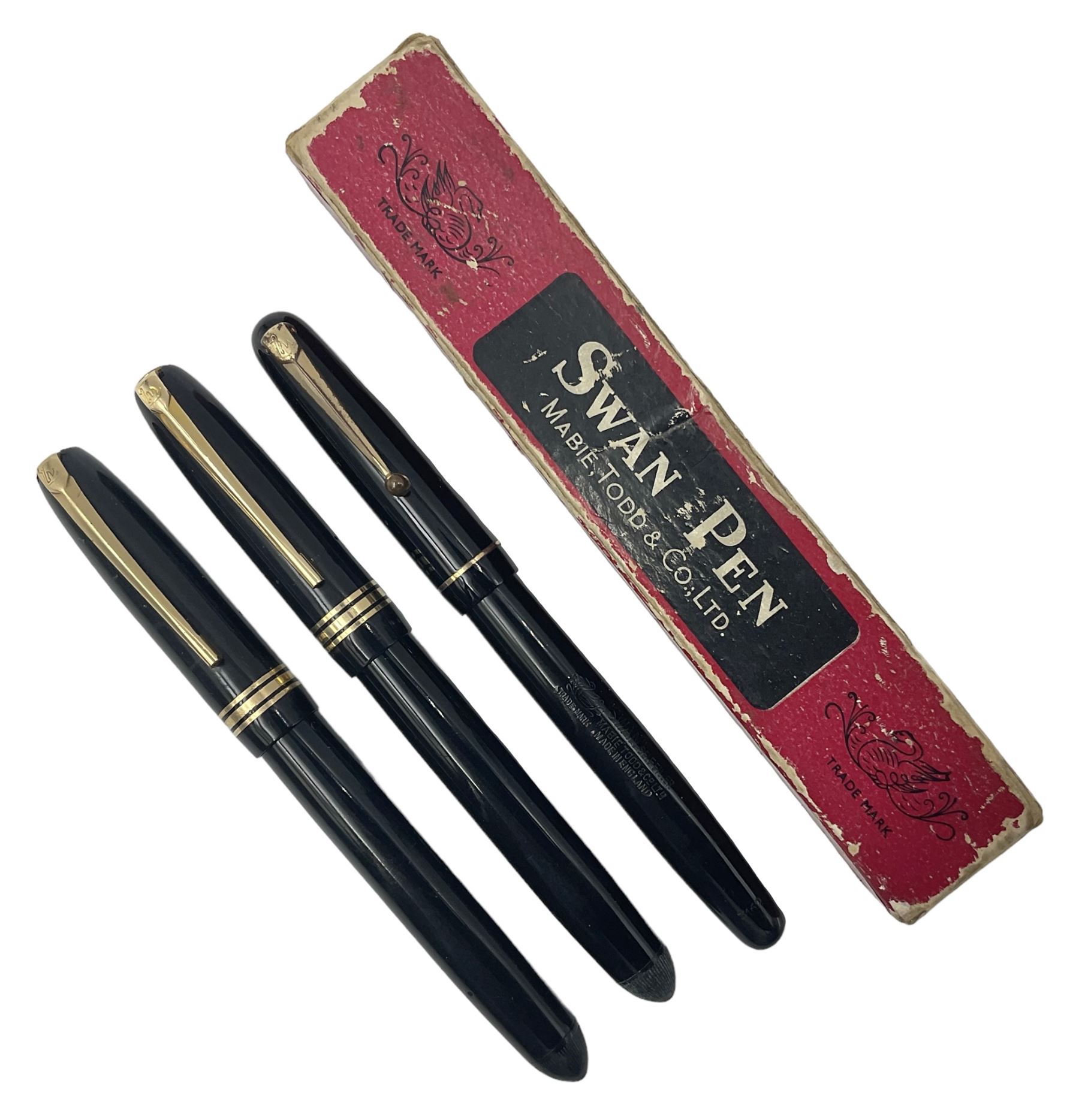 Three Swan Mabie Todd fountain pens, comprising Self Filler 3162 with black barrel and cap with single band and gold nib stamped Eternal 1 14ct, together with two Calligraph examples with gold nibs stamped 14ct, one with box, largest L12.5cm