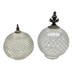 Two clear glass light shades of globular form with foliate metal mounts, tallest H29cm