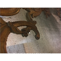  French Rococo style gilt metal fire screen, cartouche shaped ornate scrolling frame and supports, the mesh panel applied with a seated cherub, W62cm x H71cm   
