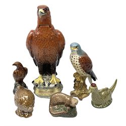Four Beswick Beneagles Whisky decanters to include Golden Eagle and otter, another White & Mackay decanter, and figure modelled as an eagle no.2316, all with marks beneath (6)